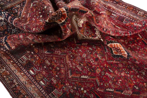 Corner detail of 2000s Shiraz rug showing border pattern and Wool pile
