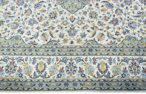 Corner detail of New Kashan rug showing border pattern and Cork pile