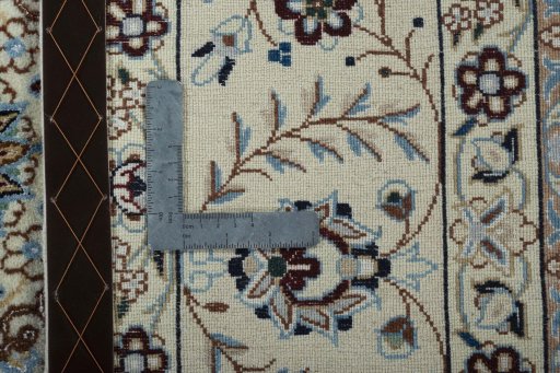 Backside of handmade 2000s Nain rug showing knot structure and weave density