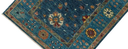 Backside of handmade New Farahan rug showing knot structure and weave density