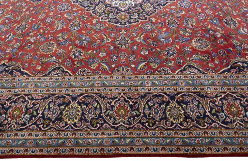 Corner detail of New Kashan rug showing border pattern and Cork pile