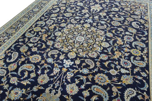 Backside of handmade 2000s Kashan rug showing knot structure and weave density