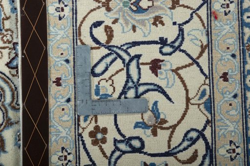 Backside of handmade New Nain rug showing knot structure and weave density