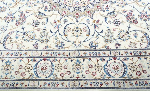 Corner detail of 2000s Nain rug showing border pattern and Wool pile