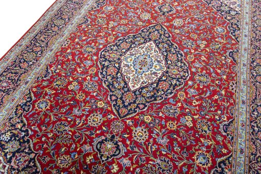 Backside of handmade New Kashan rug showing knot structure and weave density