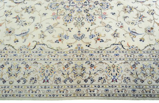 Corner detail of 2000s Kashan rug showing border pattern and Wool pile