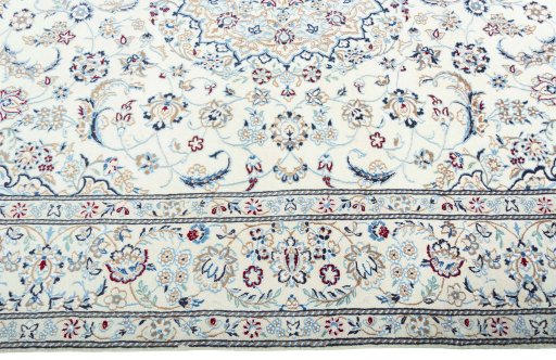 Corner detail of 2000s Nain rug showing border pattern and Wool pile