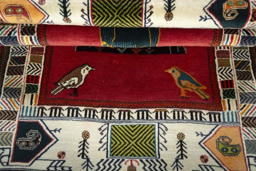 Full view of 2000s Persian Gabbeh rug from Iran / Persia, 190 × 131 cm in Red tones