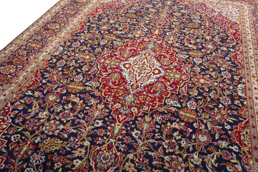 Backside of handmade 2000s Kashan rug showing knot structure and weave density