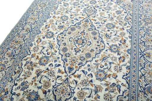 Backside of handmade 2000s Kashan rug showing knot structure and weave density