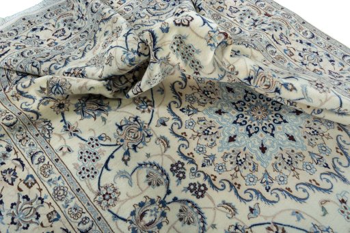 Surface texture of 2000s Nain rug with natural Wool and intricate pattern