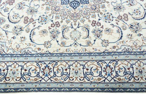 Corner detail of 2000s Nain rug showing border pattern and Wool pile