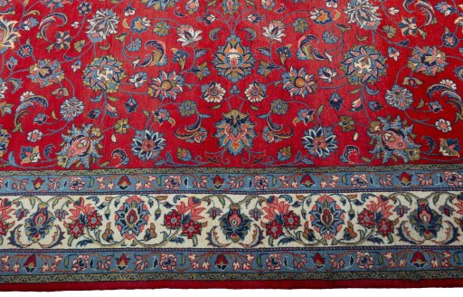 Corner detail of 2000s Sarough rug showing border pattern and Wool pile