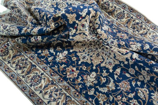 Surface texture of 2000s Nain rug with natural Wool and intricate pattern