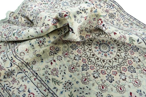 Surface texture of 2000s Nain rug with natural Wool and intricate pattern