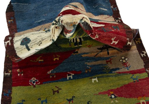 Corner detail of 2000s Persian Gabbeh rug showing border pattern and Wool pile