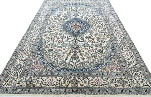 Surface texture of 2000s Nain rug with natural Wool and intricate pattern