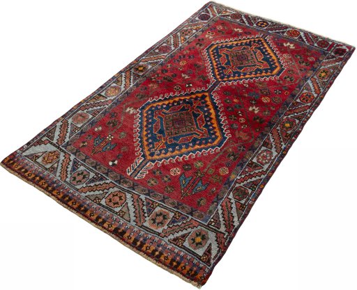 Corner detail of 2000s Shiraz rug showing border pattern and Wool pile