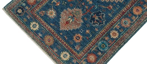 Backside of handmade New Kazak rug showing knot structure and weave density