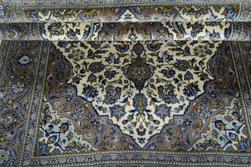 Close-up detail of 2000s Kashan rug from Iran / Persia showing Wool weave