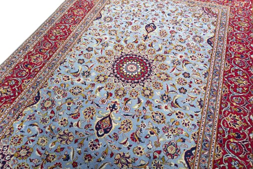 Backside of handmade 2000s Kashan rug showing knot structure and weave density