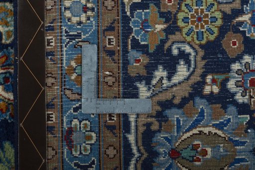Backside of handmade 2000s Kashmar rug showing knot structure and weave density
