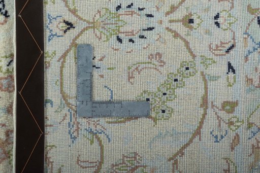 Backside of handmade New Kashan rug showing knot structure and weave density