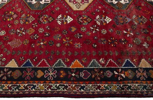 Full view of 2000s Shiraz rug from Iran / Persia, 330 × 229 cm in Red tones
