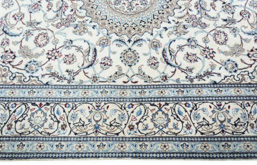 Corner detail of 2000s Nain rug showing border pattern and Wool pile