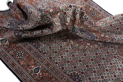 Surface texture of 2000s Moud rug with natural Wool and intricate pattern