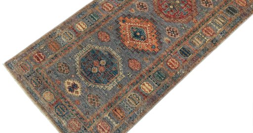 Backside of handmade New Kazak rug showing knot structure and weave density