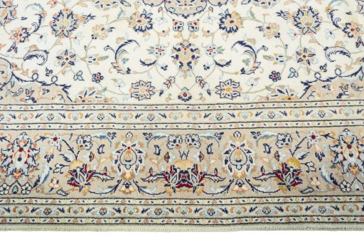 Corner detail of New Kashan rug showing border pattern and Wool pile