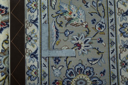 Backside of handmade New Kashan rug showing knot structure and weave density