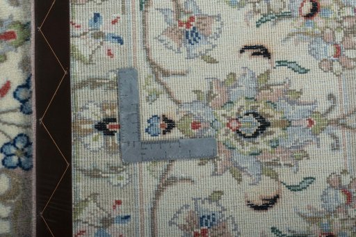 Backside of handmade New Kashan rug showing knot structure and weave density