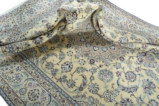 Surface texture of 2000s Nain rug with natural Wool and intricate pattern