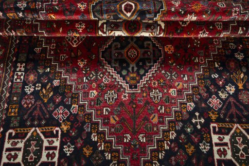 Full view of 2000s Shiraz rug from Iran / Persia, 213 × 150 cm in Red tones