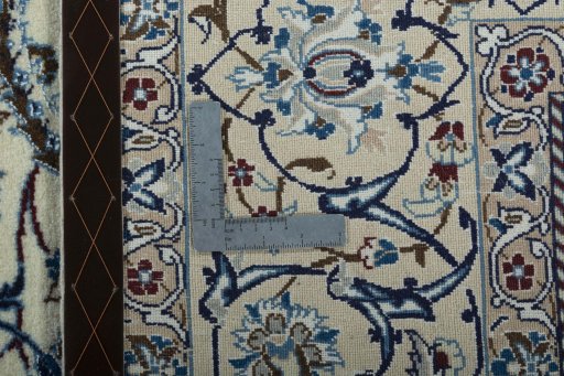 Backside of handmade 2000s Nain rug showing knot structure and weave density