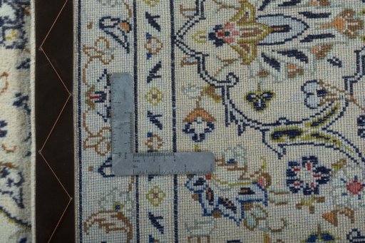 Backside of handmade 2000s Kashan rug showing knot structure and weave density
