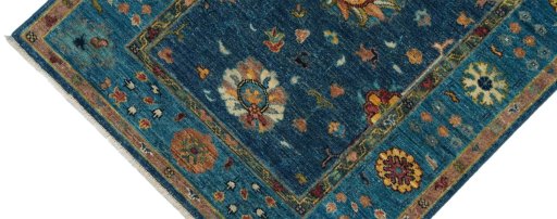 Backside of handmade New Farahan rug showing knot structure and weave density