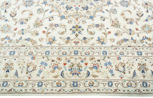 Corner detail of New Kashan rug showing border pattern and Wool pile