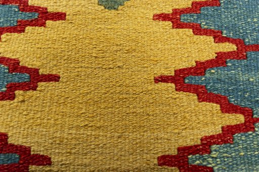 Backside of handmade New Modern Design rug showing knot structure and weave density