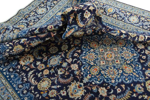 Surface texture of 2000s Kashan rug with natural Wool and intricate pattern