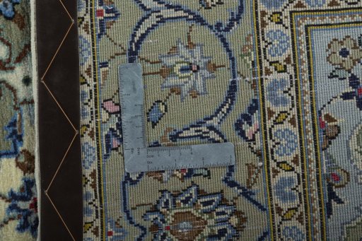 Backside of handmade 2000s Kashan rug showing knot structure and weave density