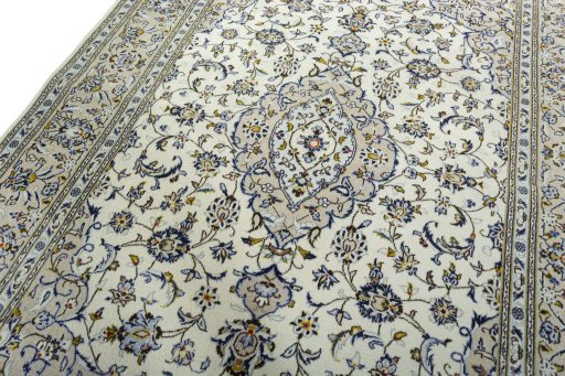 Backside of handmade 2000s Kashan rug showing knot structure and weave density