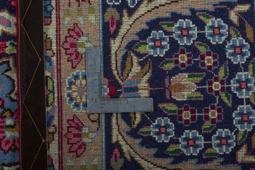 Backside of handmade 1970s Kerman rug showing knot structure and weave density