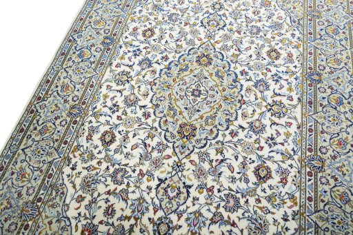 Backside of handmade 2000s Kashan rug showing knot structure and weave density