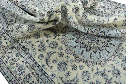 Surface texture of 2000s Nain rug with natural Wool and intricate pattern