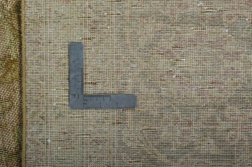 Backside of handmade 1970s Vintage rug showing knot structure and weave density