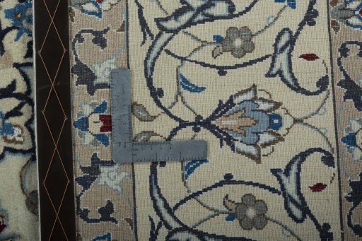 Backside of handmade 2000s Nain rug showing knot structure and weave density