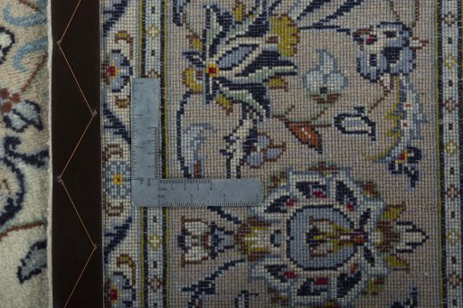 Surface texture of 2000s Kashan rug with natural Wool and intricate pattern